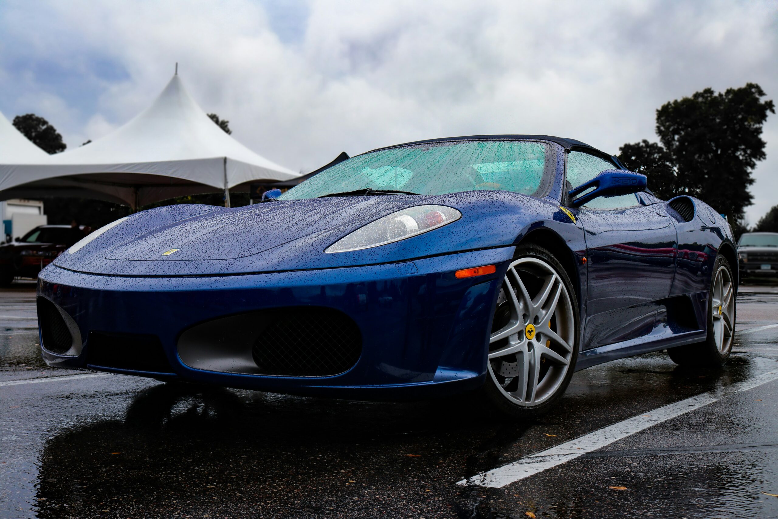 Blue ferrari in the rain