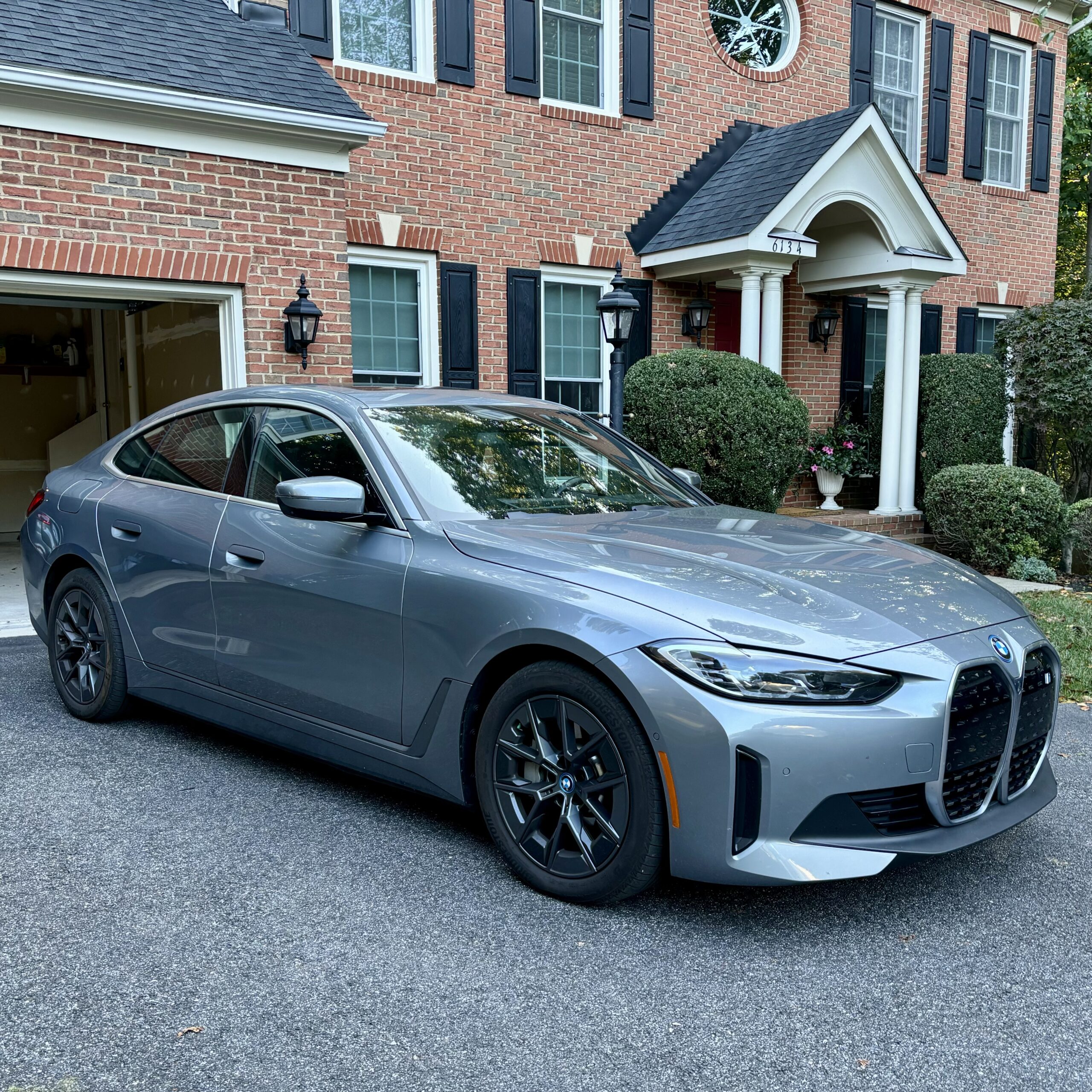 Grey BMW sitting in driveway